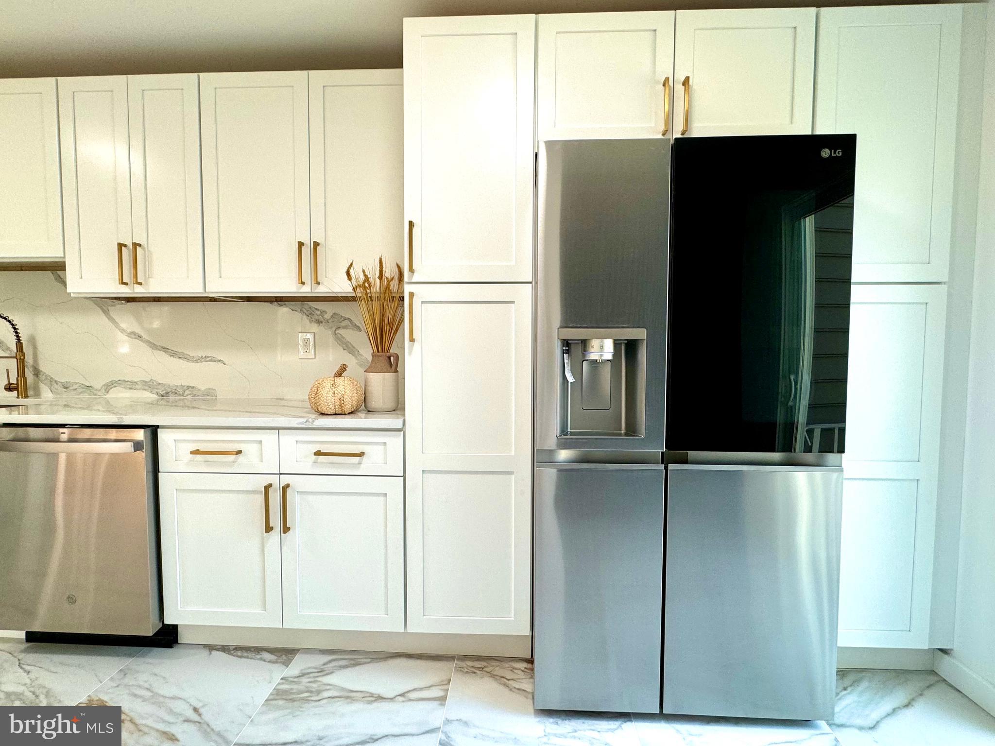 3 Mint Leaf Drive Hamilton, NJ 08690 - Photo 13 of 33 a kitchen with a refrigerator and cabinets