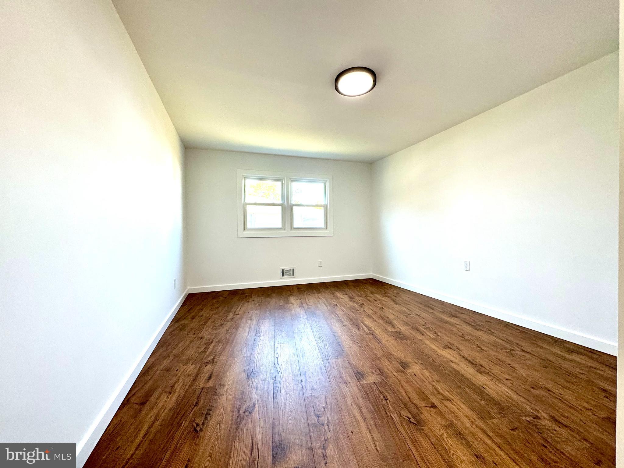 3 Mint Leaf Drive Hamilton, NJ 08690 - Photo 16 of 33 a view of a room with wooden floor and window