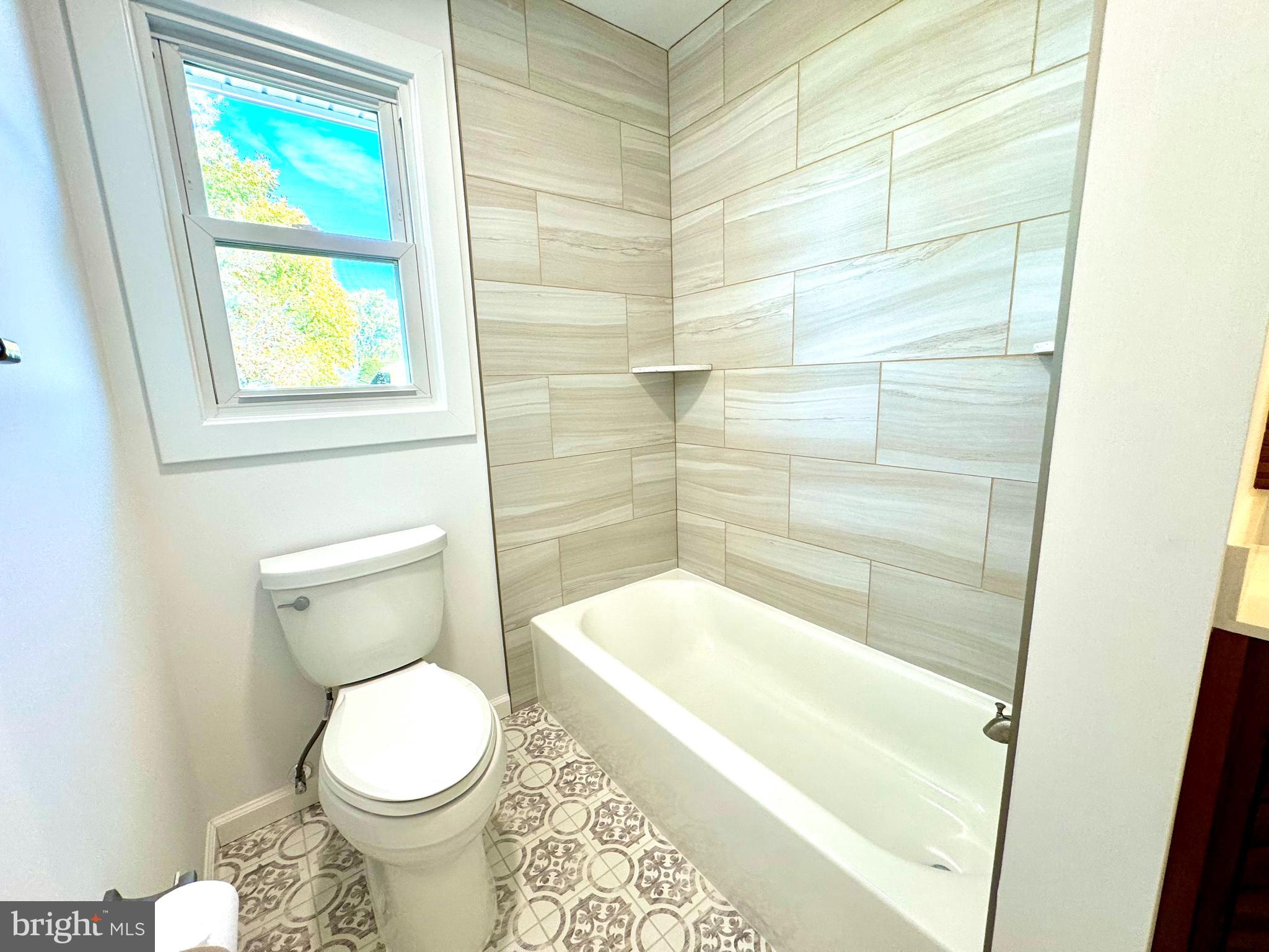 3 Mint Leaf Drive Hamilton, NJ 08690 - Photo 24 of 33 a bathroom with a toilet and a bathtub