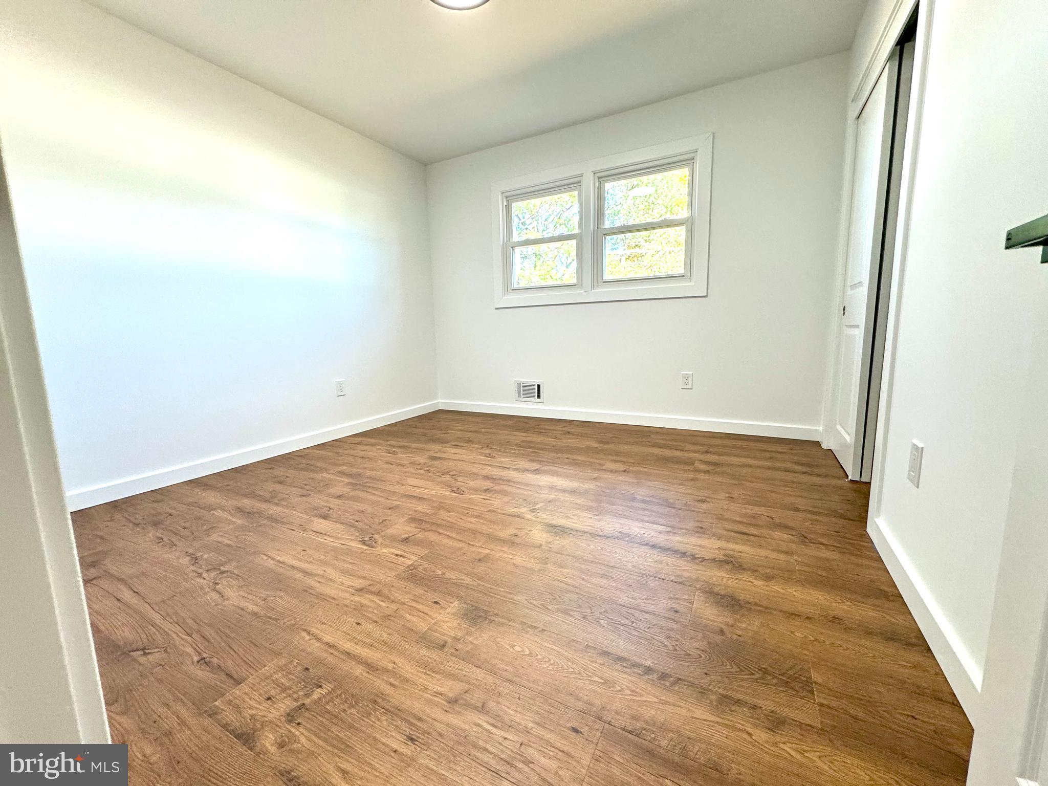 3 Mint Leaf Drive Hamilton, NJ 08690 - Photo 25 of 33 an empty room with wooden floor and windows