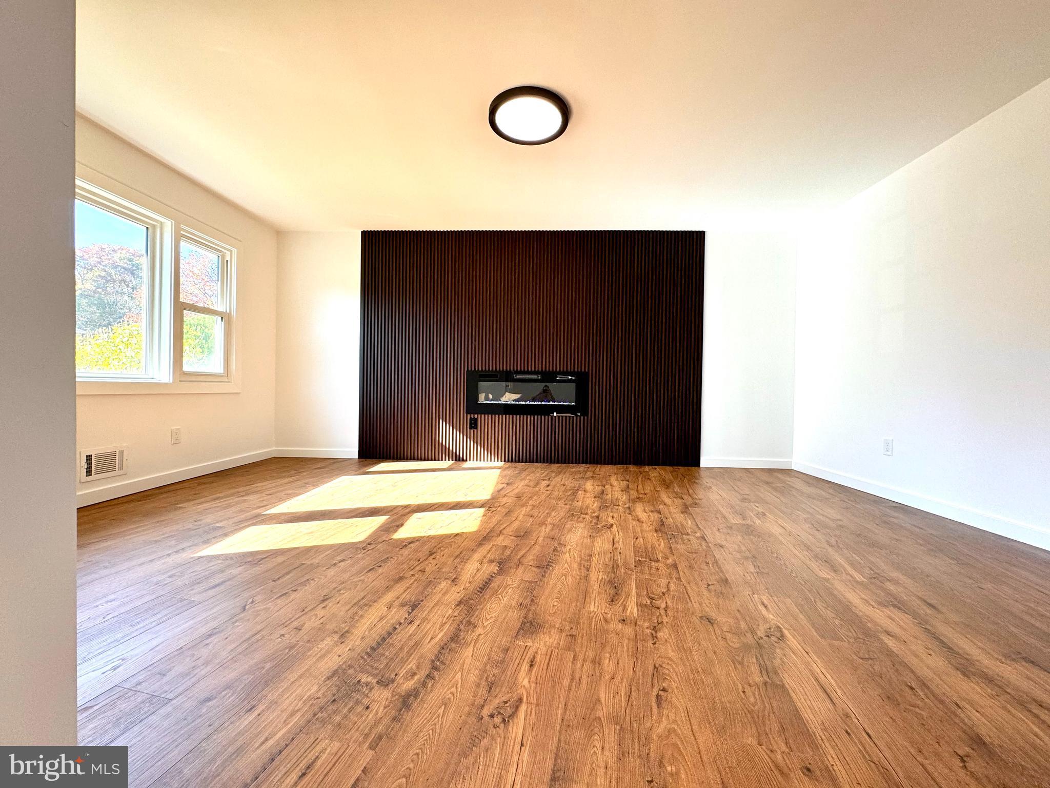 3 Mint Leaf Drive Hamilton, NJ 08690 - Photo 5 of 33 a view of empty room with wooden floor and fan