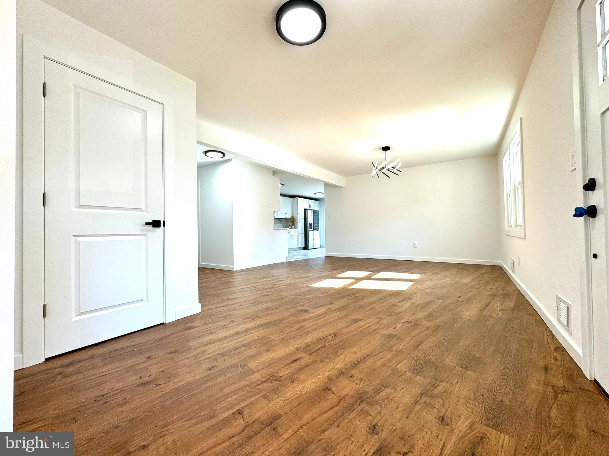 3 Mint Leaf Drive Hamilton, NJ 08690 - Photo 6 of 33 an empty room with wooden floor and windows