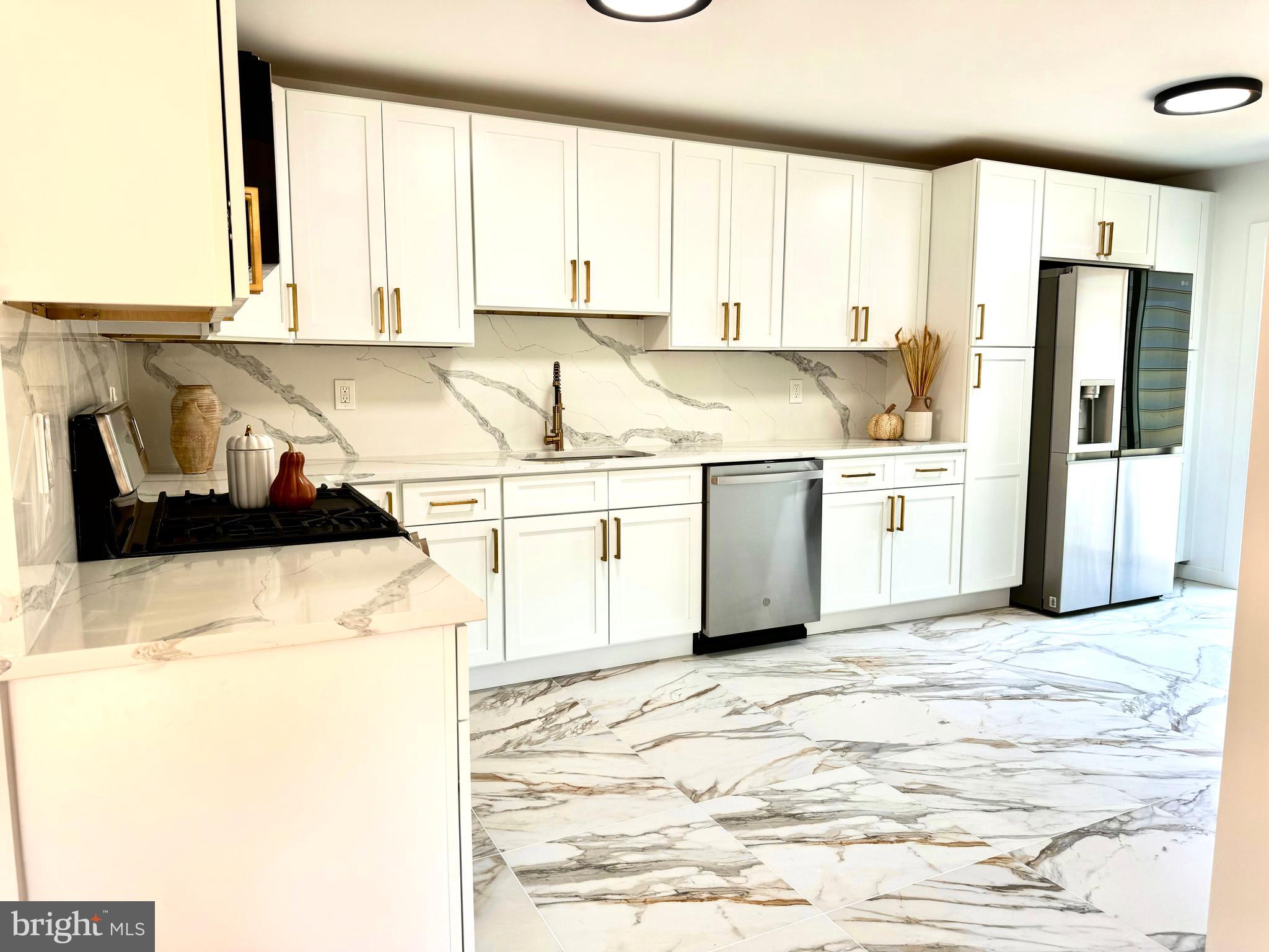 3 Mint Leaf Drive Hamilton, NJ 08690 - Photo 7 of 33 a kitchen with stainless steel appliances granite countertop a stove a sink and a refrigerator