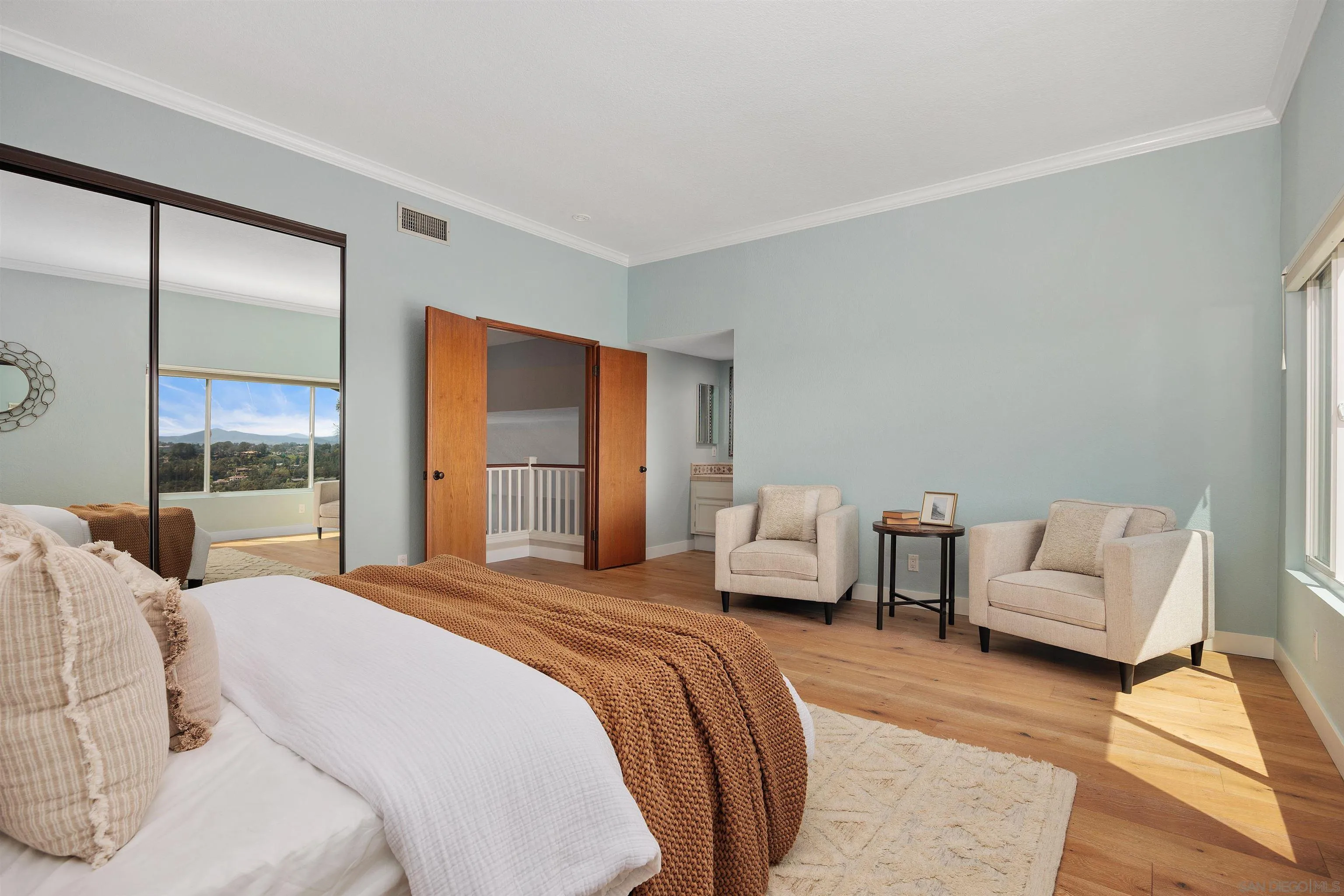 1533 Pacific Ranch Drive Encinitas, CA 92024 - Photo 25 of 52 a bedroom with a bed and large window