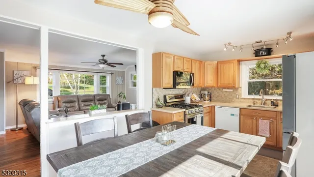 an aerial view of residential house with outdoor space and trees all around