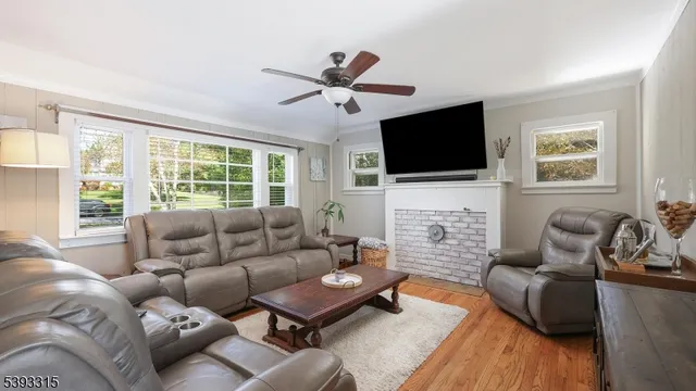 an aerial view of residential house with outdoor space and trees all around