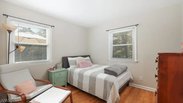 a aerial view of residential house with outdoor space and trees all around