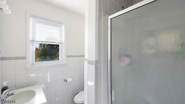 a front view of house with yard and trees