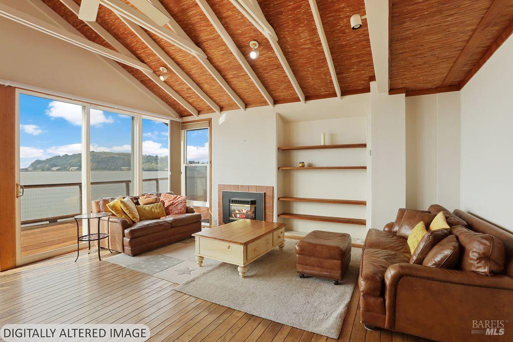 34 Sandy Beach Road Vallejo, CA 94590 - Photo 19 of 63 a living room with furniture and a floor to ceiling window
