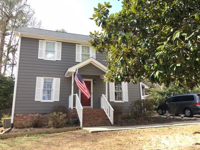 7329 Mill Ridge Road Raleigh, NC 27613 - Photo 2 of 25 a front view of a house with a yard
