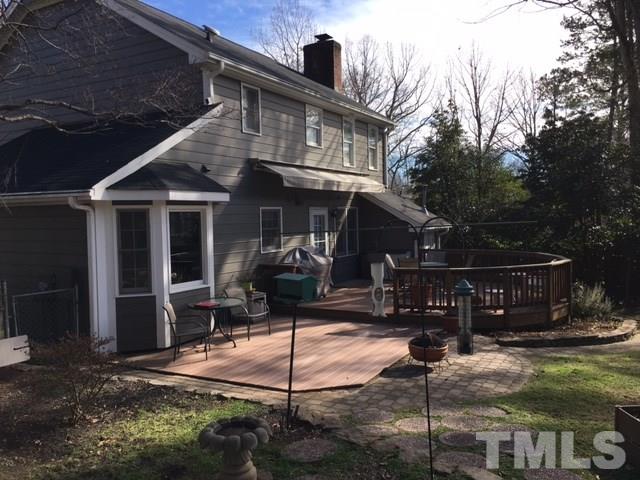 7329 Mill Ridge Road Raleigh, NC 27613 - Photo 4 of 25 a front view of house with yard outdoor seating and barbeque oven