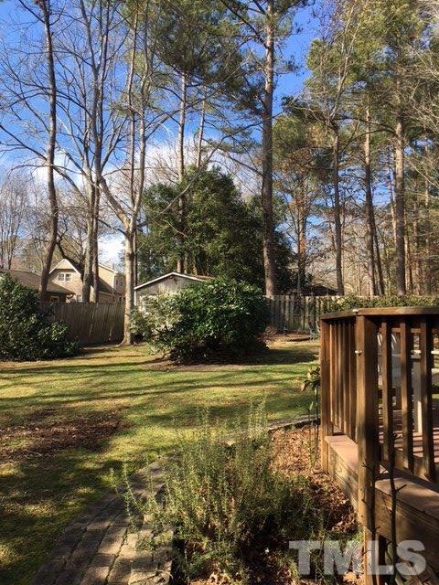 7329 Mill Ridge Road Raleigh, NC 27613 - Photo 6 of 25 a view of a fountain in a yard next to a building