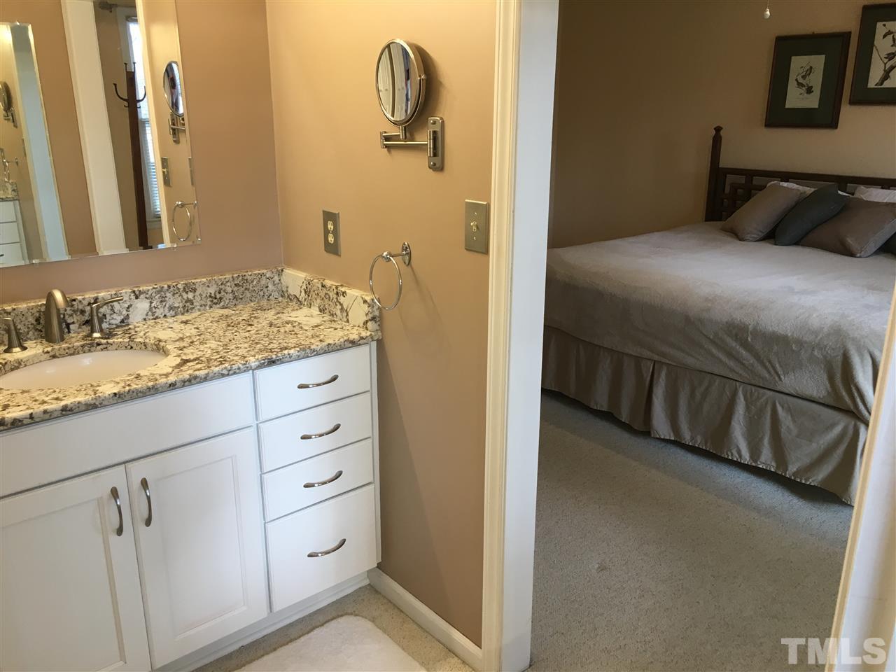 7329 Mill Ridge Road Raleigh, NC 27613 - Photo 9 of 25 a bathroom with a granite countertop sink and a mirror