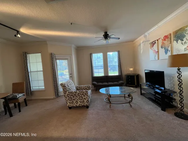 a large kitchen with kitchen island a large island in it