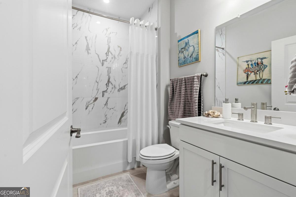 1190 Little Shls Road Greensboro, GA 30642 - Photo 8 of 44 a bathroom with a toilet a sink and a bathtub