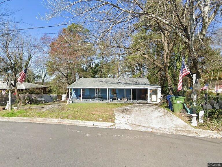 2193 Abner Place Northwest Atlanta, GA 30318 - Photo 1 of 1 a front view of house with yard and trees around
