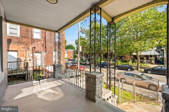 a building outdoor space with patio furniture and glass door