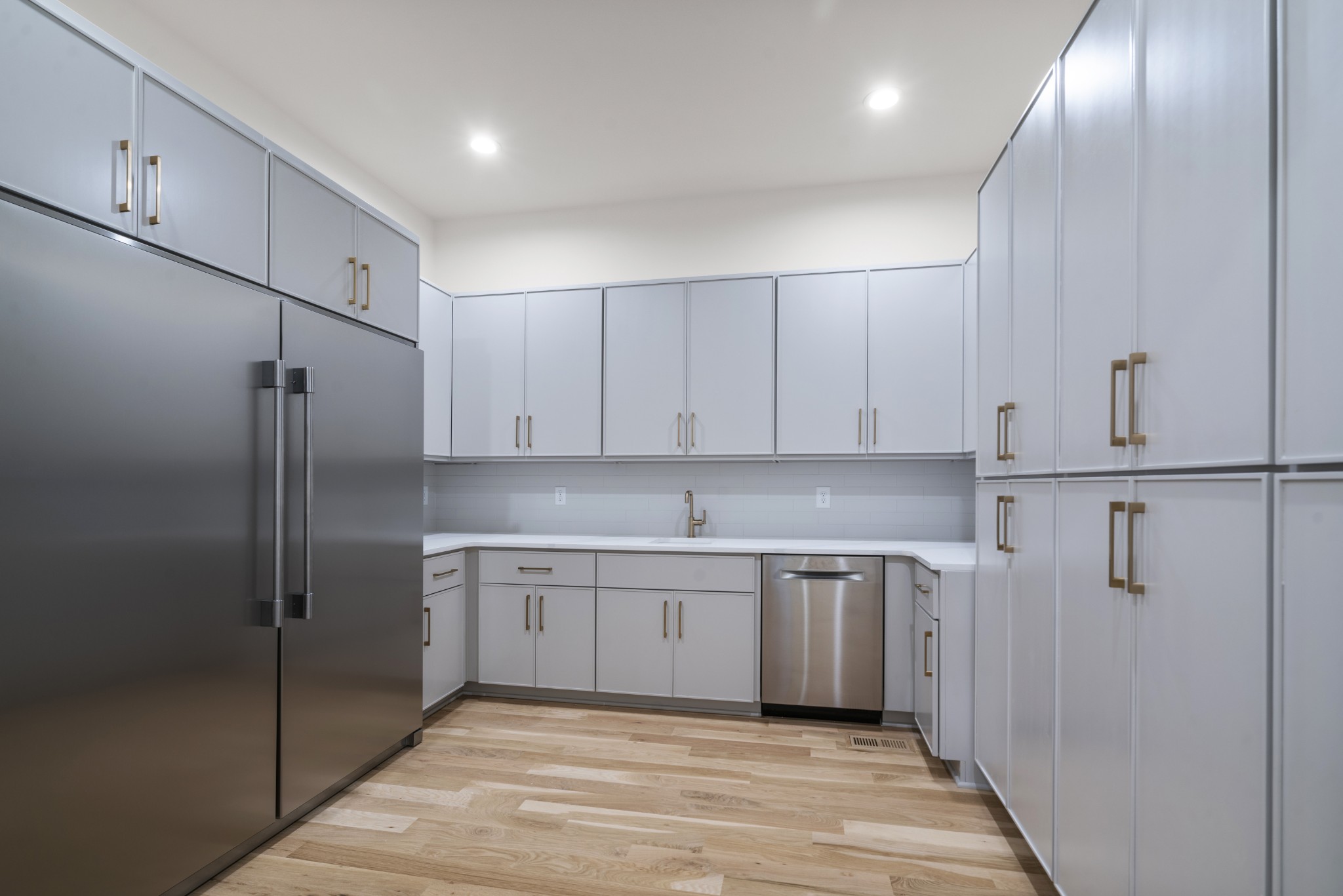1323 Harding Place Nashville, TN 37215 - Photo 16 of 41 a kitchen with a sink cabinets and stainless steel appliances