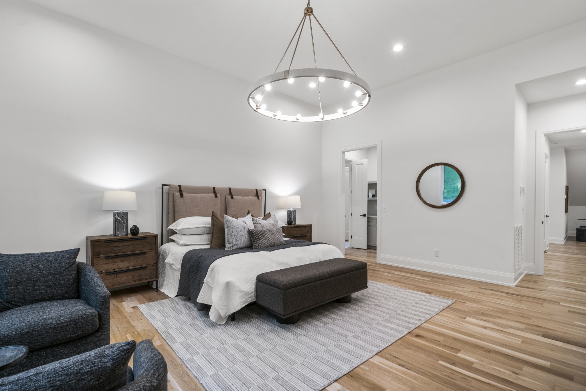 1323 Harding Place Nashville, TN 37215 - Photo 18 of 41 a spacious bedroom with a bed window and a chandelier