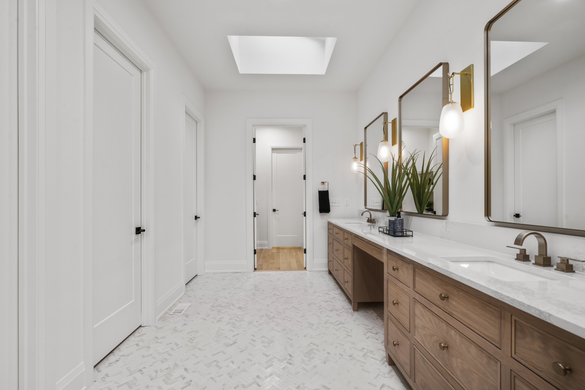 1323 Harding Place Nashville, TN 37215 - Photo 20 of 41 a spacious bathroom with a double vanity sink a large mirror and a bathtub
