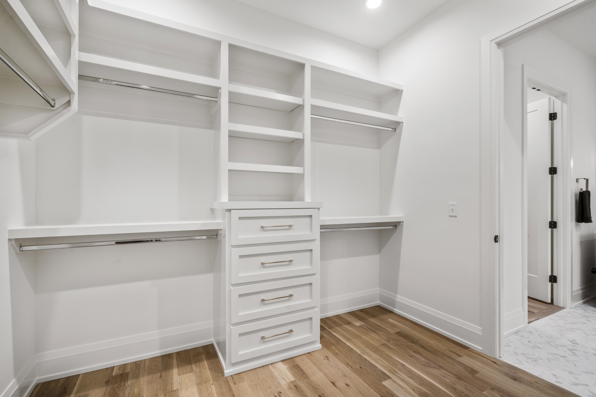 1323 Harding Place Nashville, TN 37215 - Photo 22 of 41 a view of walk in closet with empty racks