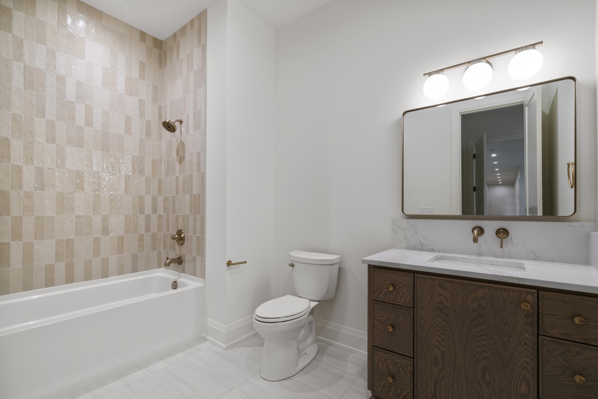 1323 Harding Place Nashville, TN 37215 - Photo 28 of 41 a bathroom with a toilet a sink a bathtub and a mirror