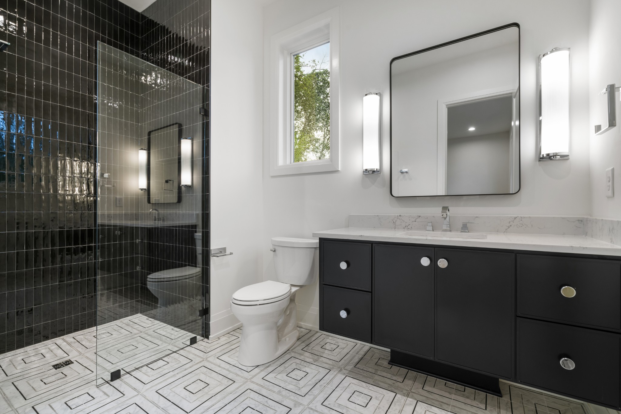 1323 Harding Place Nashville, TN 37215 - Photo 30 of 41 a bathroom with a toilet a sink and mirror