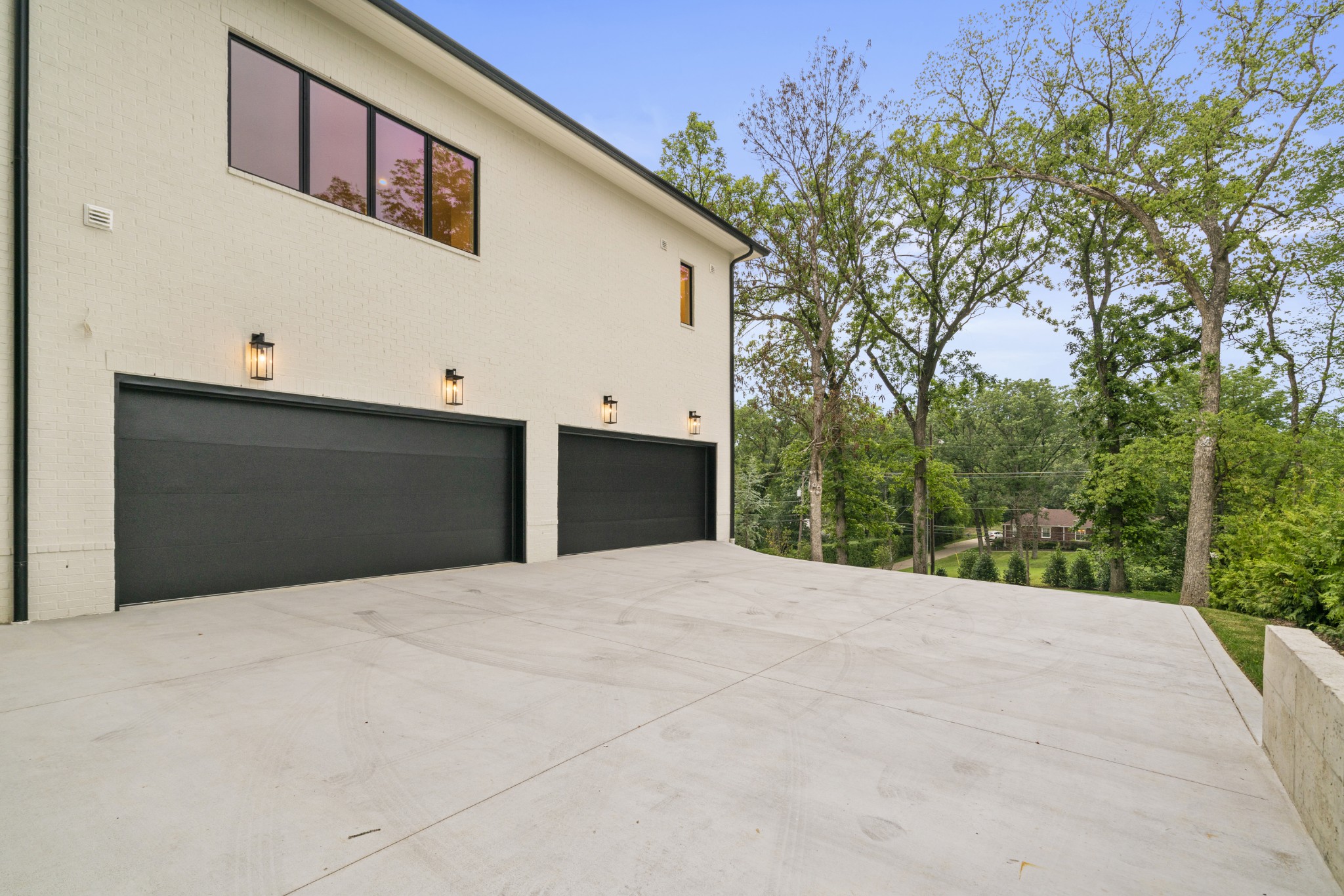 1323 Harding Place Nashville, TN 37215 - Photo 39 of 41 a front view of a house with a yard and garage