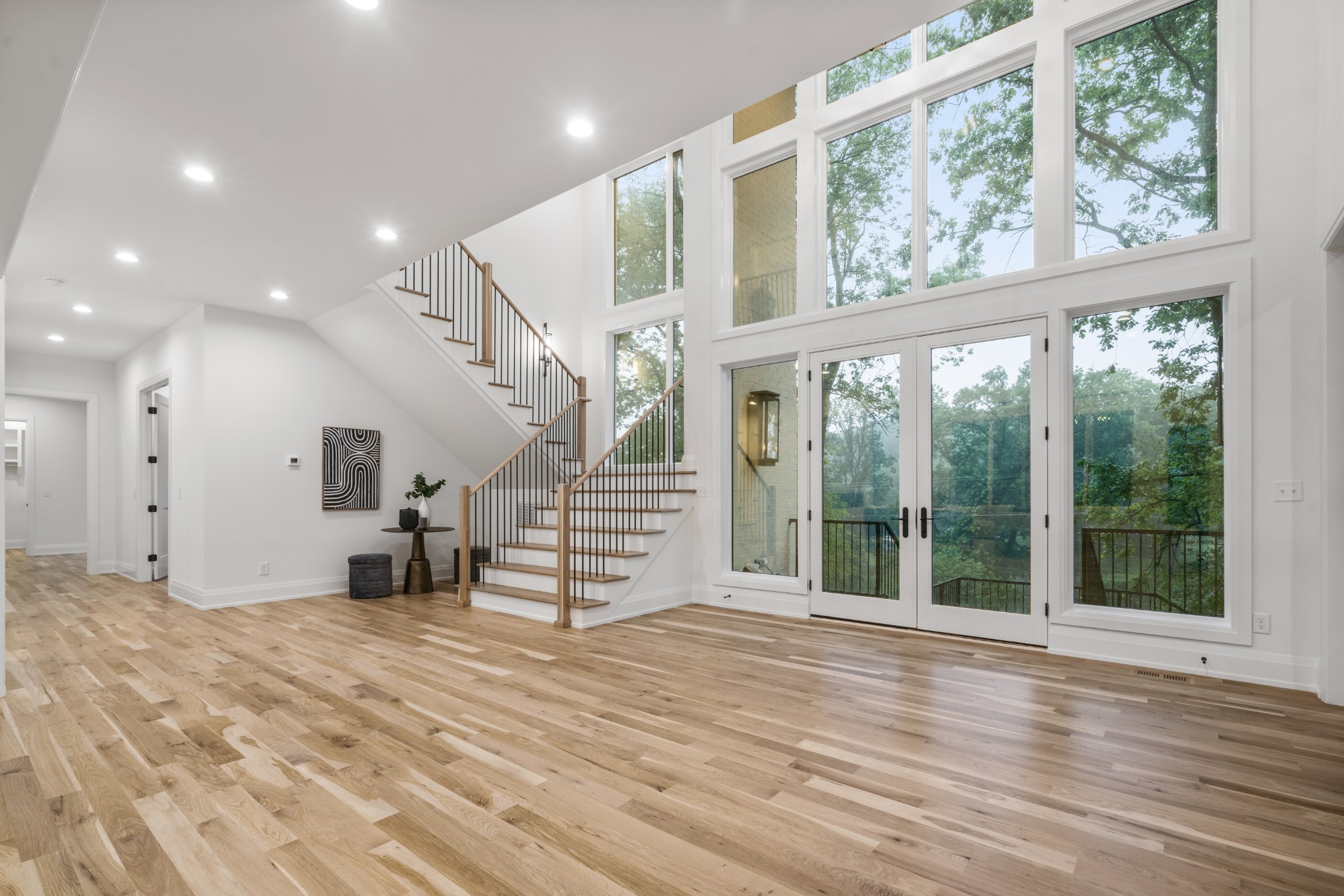 1323 Harding Place Nashville, TN 37215 - Photo 5 of 41 a view of an empty room with wooden floor and a window