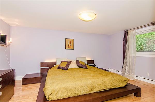 59 Wallis Road Brookline, MA 02467 - Photo 13 of 28 a bedroom with a bed and wooden floor