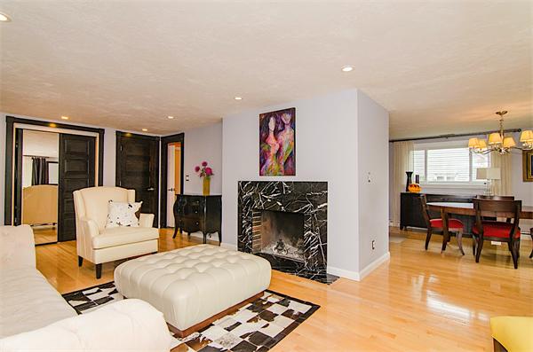 59 Wallis Road Brookline, MA 02467 - Photo 5 of 28 a living room with furniture a fireplace and a flat screen tv