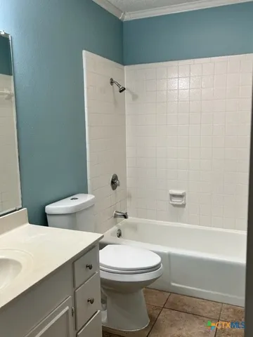 a bathroom with a toilet a sink and a bathtub