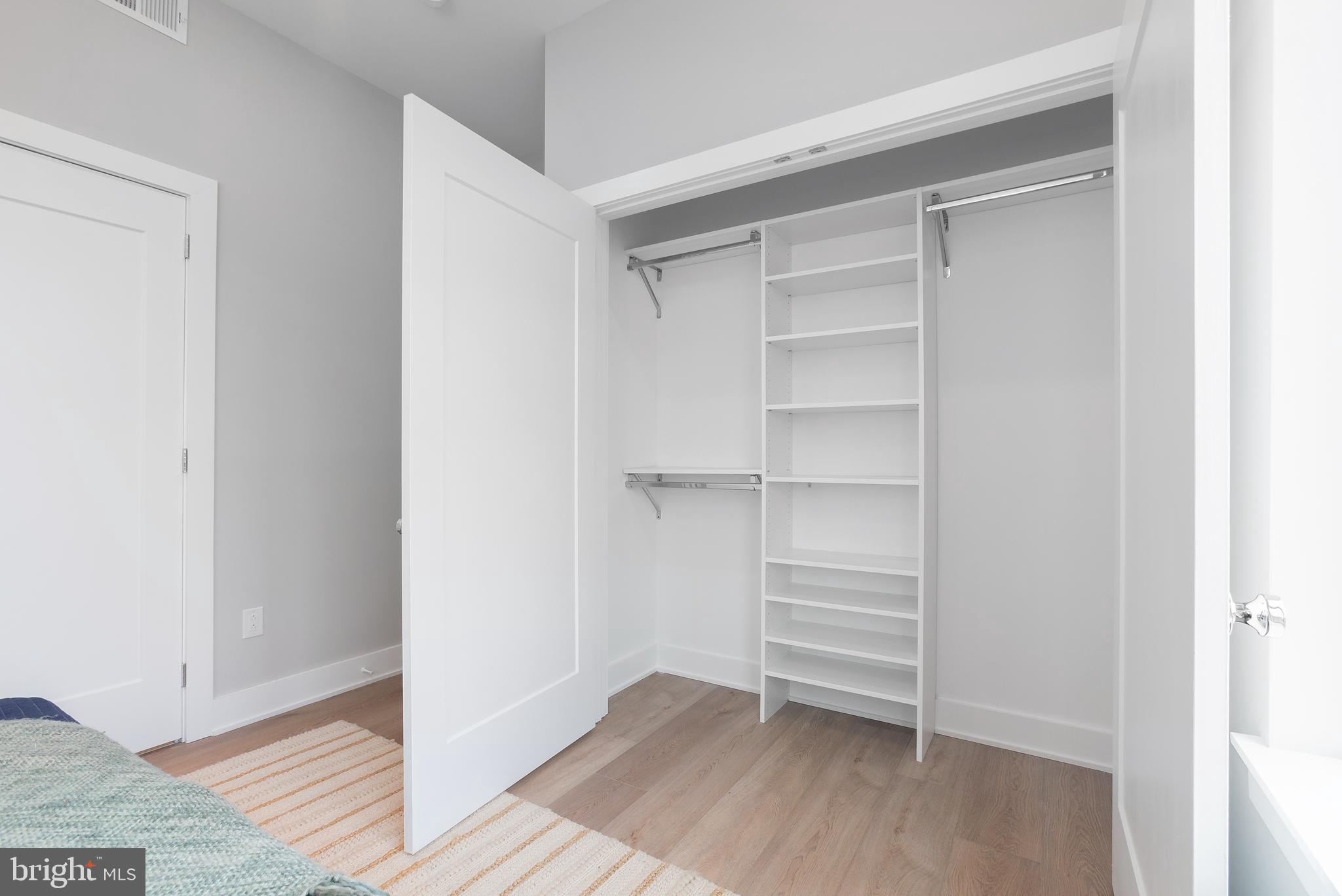 52 West Washington Lane, Unit 200 Philadelphia, PA 19144 - Photo 25 of 30 a view of walk in closet with empty racks