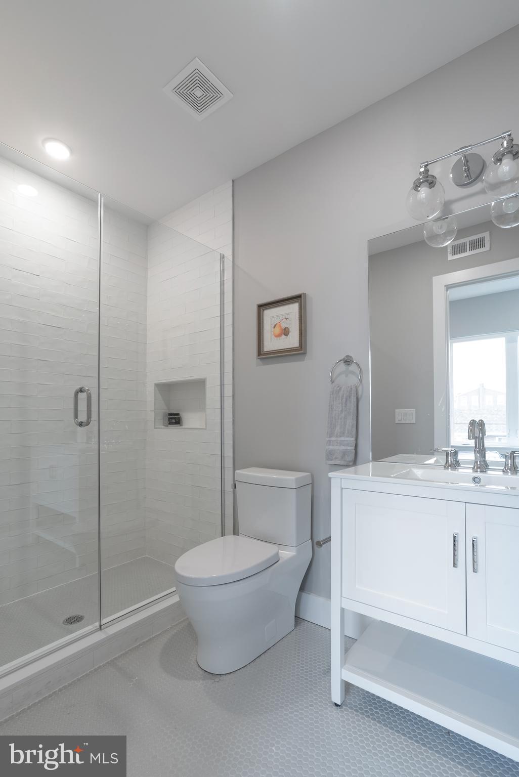 52 West Washington Lane, Unit 200 Philadelphia, PA 19144 - Photo 26 of 30 a spacious bathroom with a double vanity sink toilet and shower