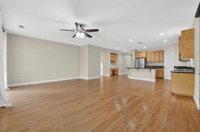 a view of kitchen with wooden floor and window