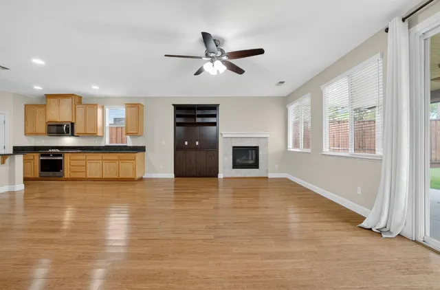 a view of a kitchen with a sink and a stove top oven