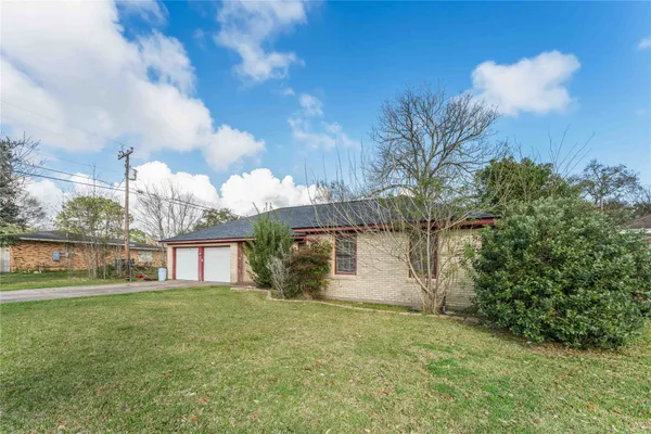 a backyard of a house with lots of green space