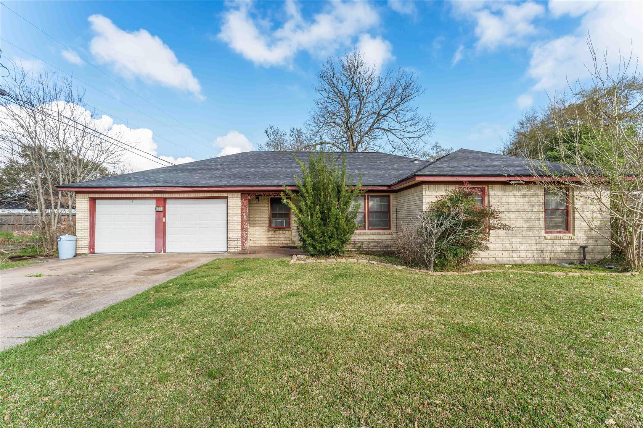 1015 Layman Street La Marque, TX 77568 - Photo 2 of 14 a view of a house with a yard and large tree