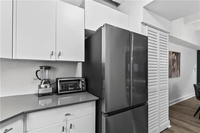 a kitchen with appliances and cabinets