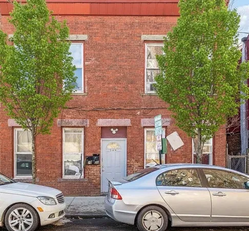 a front view of a house with parking space