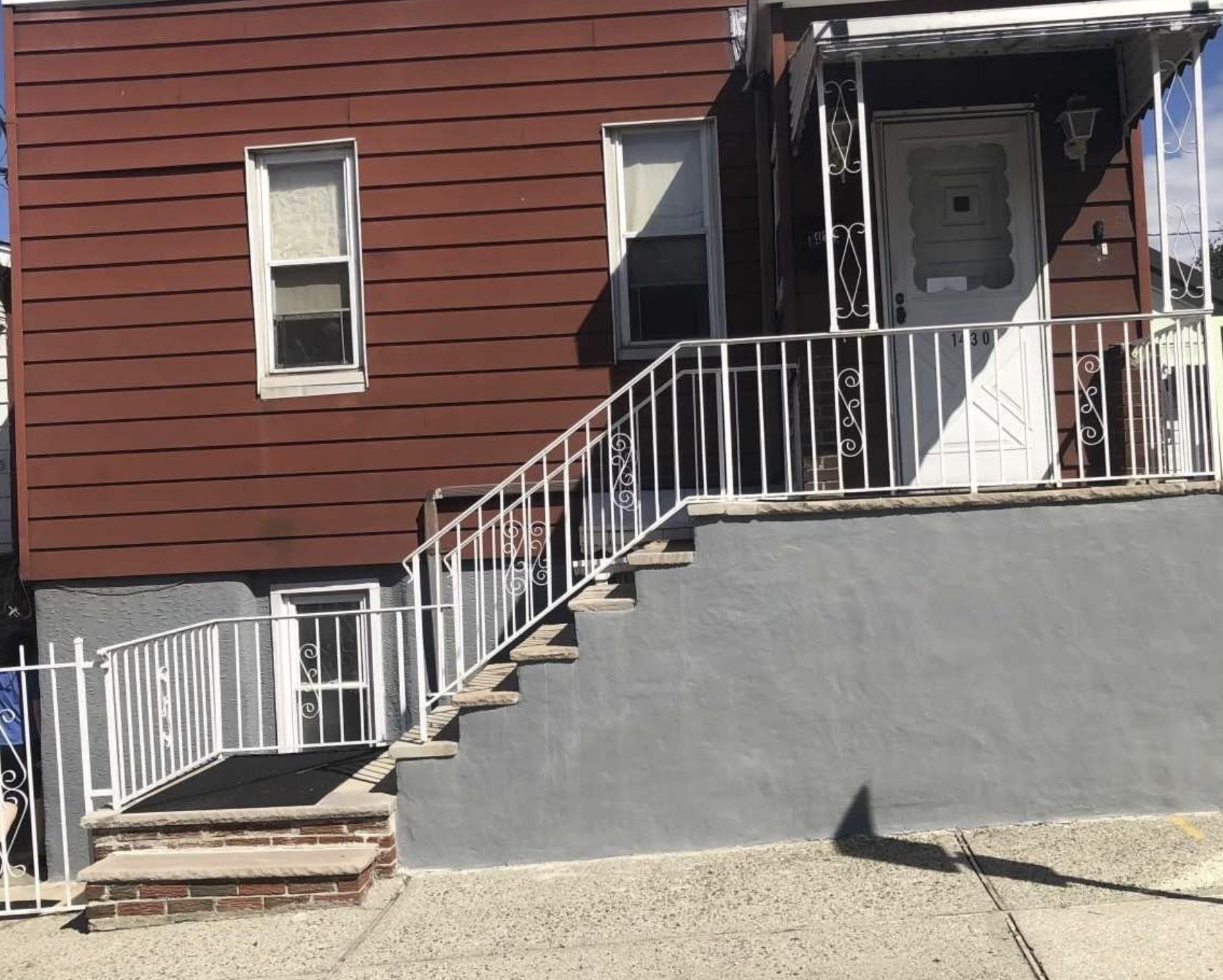 a view of a house with wooden floor and stairs