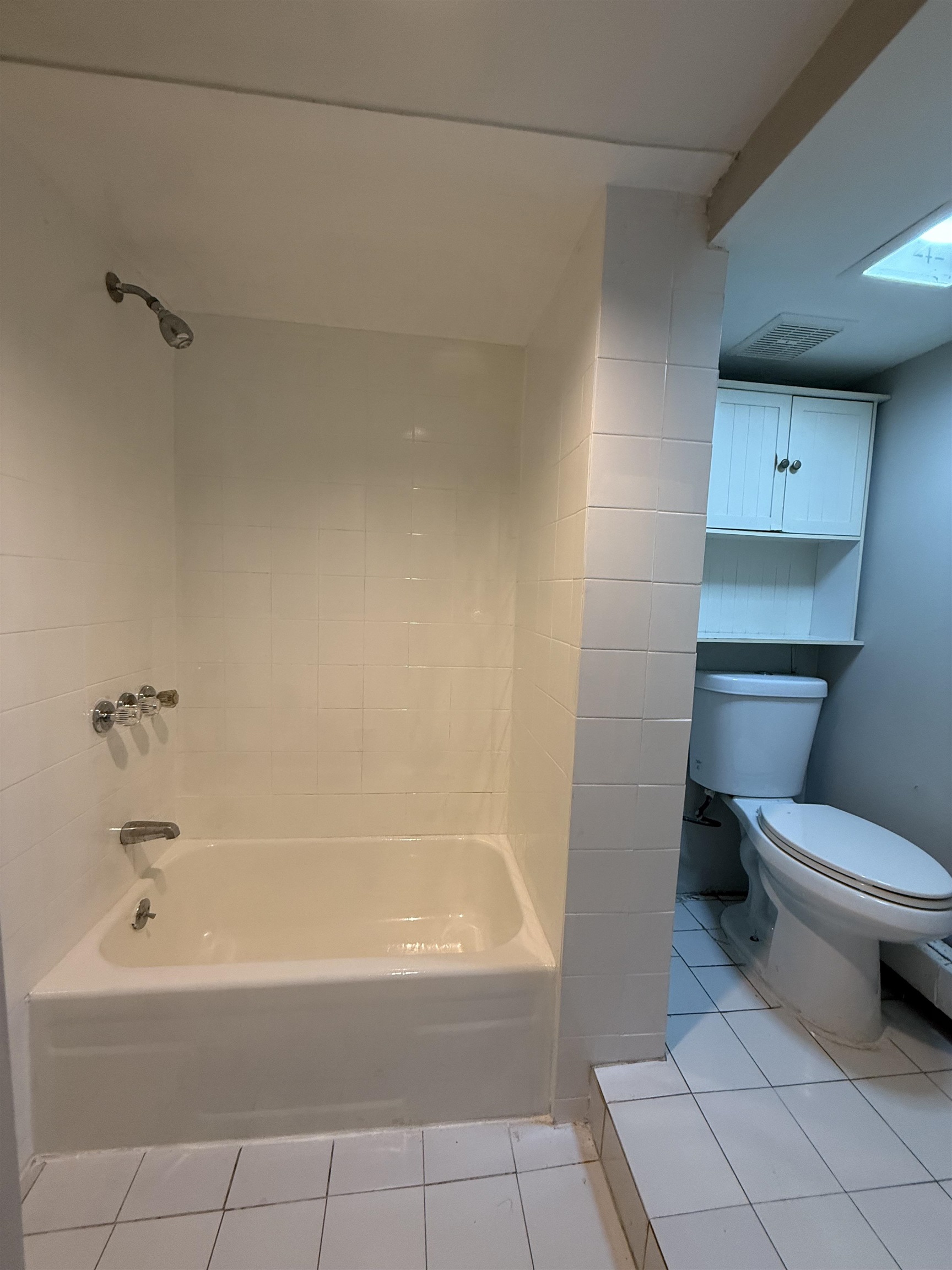 1430 44th Street, Unit 1 North Bergen, NJ 07047 - Photo 5 of 9 a bathroom with a sink a toilet and bathtub