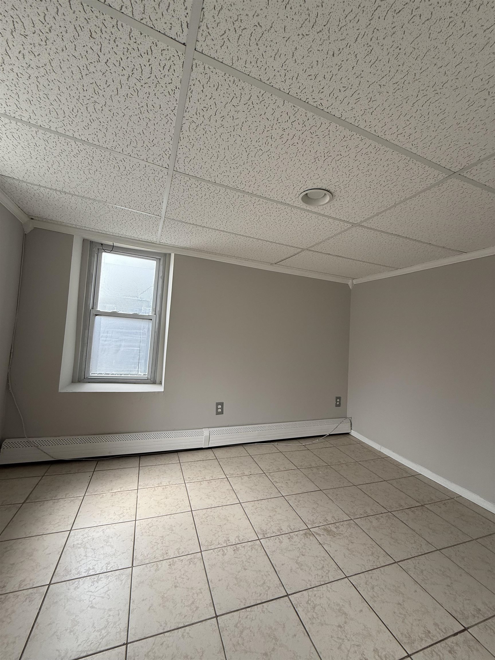 1430 44th Street, Unit 1 North Bergen, NJ 07047 - Photo 6 of 9 a view of an empty room with a window