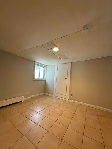 a view of an empty room and a window