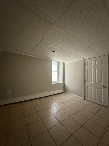 a view of an empty room and window