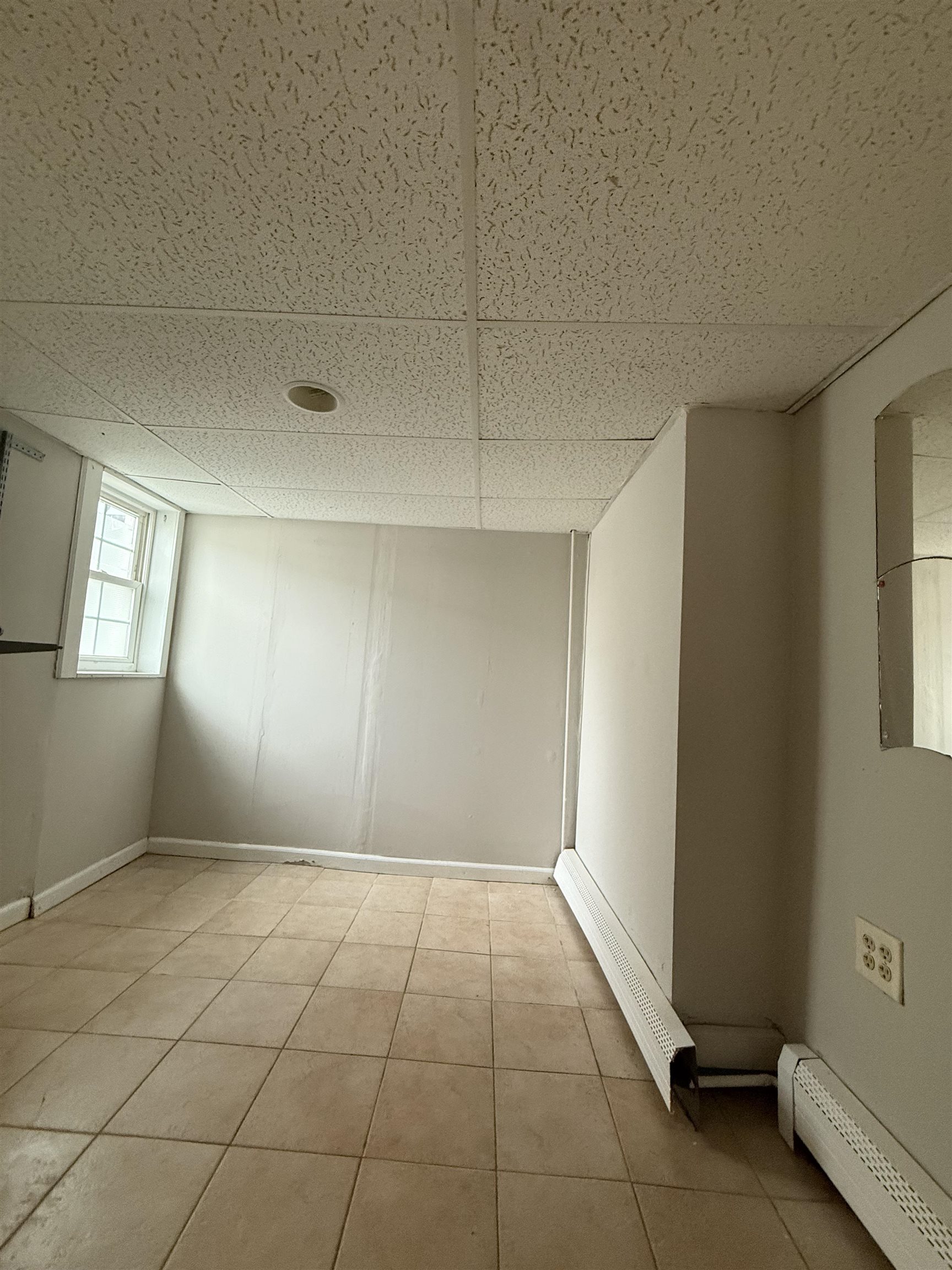 1430 44th Street, Unit 1 North Bergen, NJ 07047 - Photo 9 of 9 a view of an empty room and window