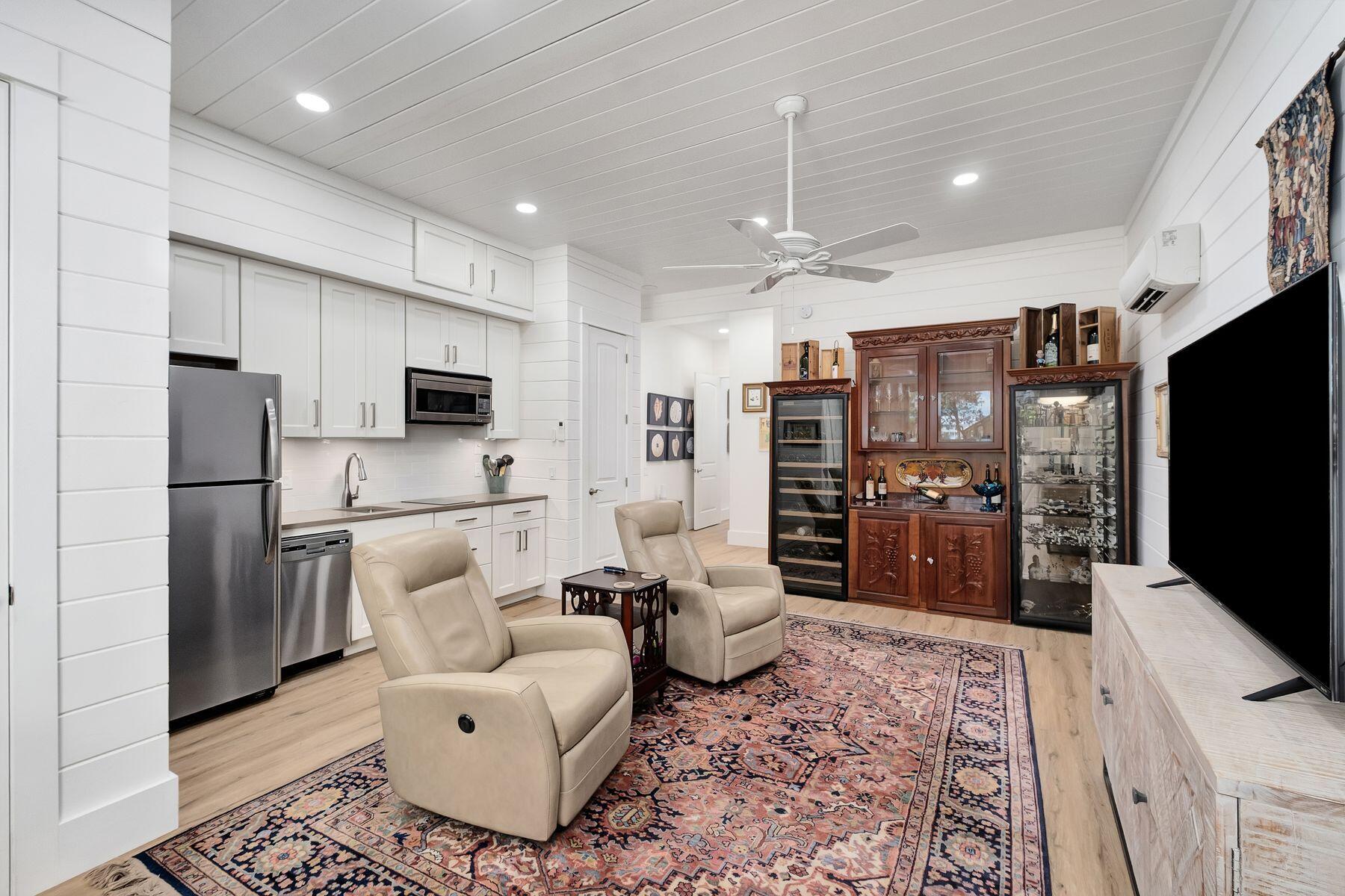 363 Pelican Circle Inlet Beach, FL 32461 - Photo 16 of 80 a living room with furniture a flat screen tv and refrigerator