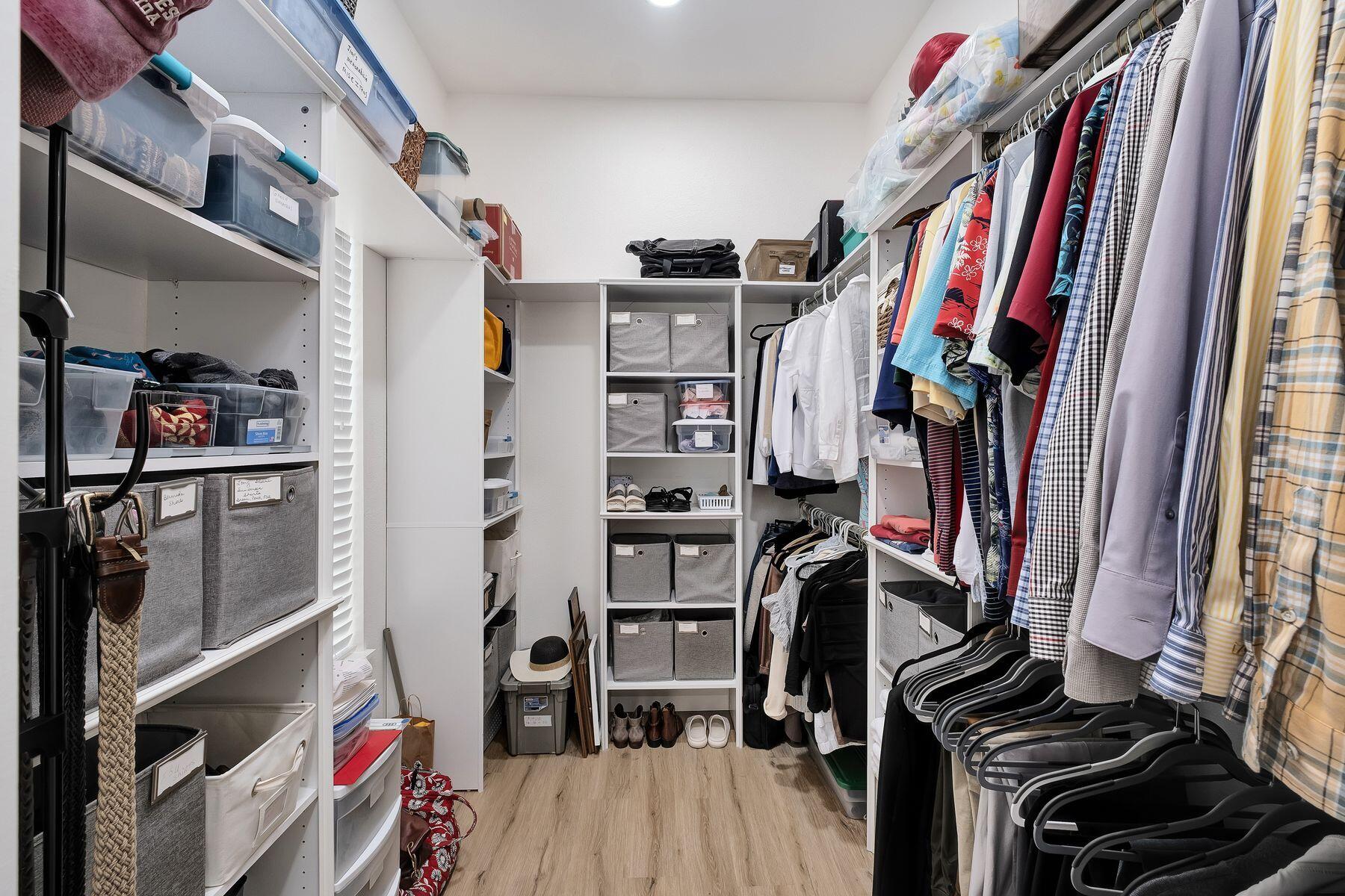 363 Pelican Circle Inlet Beach, FL 32461 - Photo 27 of 80 a view of walk in closet with clothes and shoes