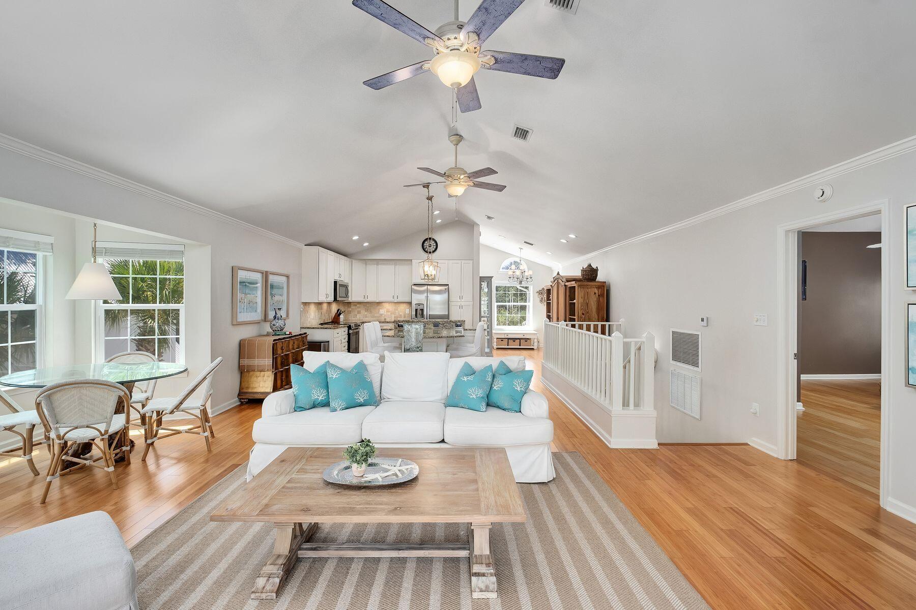 363 Pelican Circle Inlet Beach, FL 32461 - Photo 28 of 80 a view of a livingroom with furniture a rug a chandelier and wooden floor