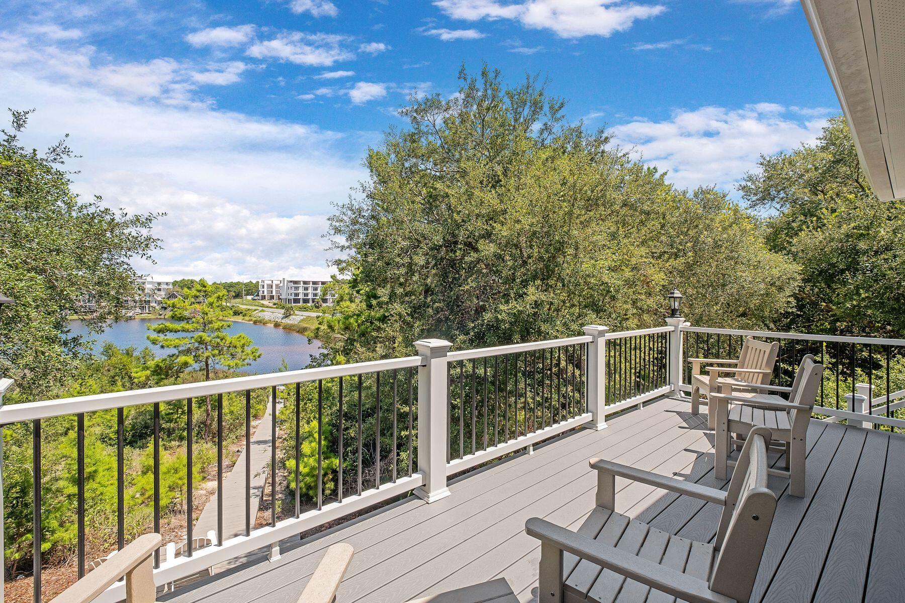 363 Pelican Circle Inlet Beach, FL 32461 - Photo 52 of 80 a view of a balcony with wooden floor and fence